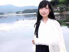 Japanese girl unwraps bandage from her injured ankle