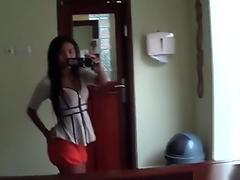 Sexy Brunette Asian Babe Fools Around With The Camera