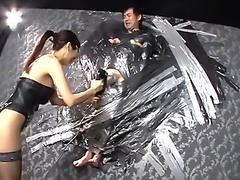 Femdom provide post orgasm to a man who is stick on the wall by fucking mac